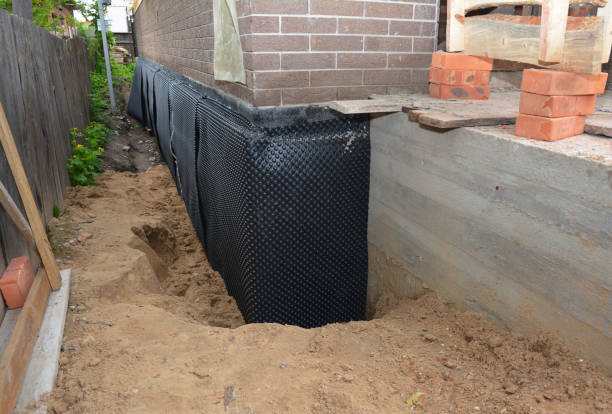 SJ Waterproofing Pros technician performing targeted Foundation Crack Repair assessment in Perrysville, IN